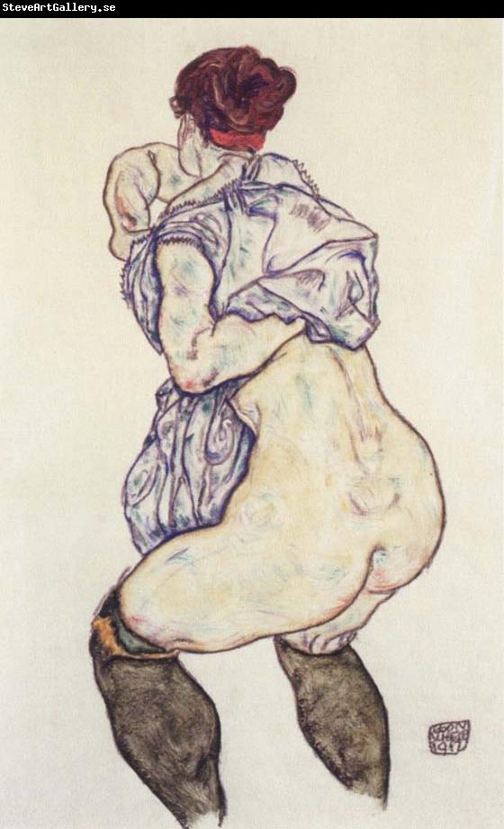 Egon Schiele woman undressing